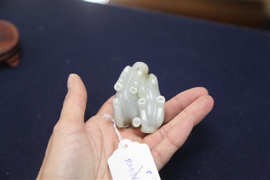 A Chinese pale celadon and russet jade group of two horses, length 6cm